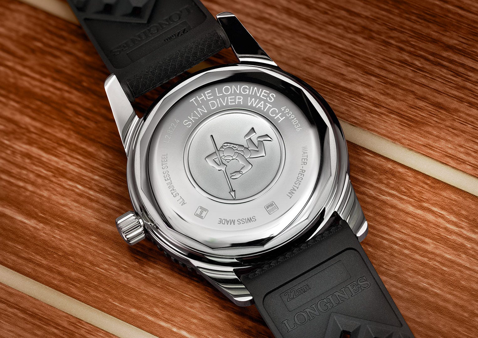 The Longines caseback featuring its iconic spear-fishing diver emblem